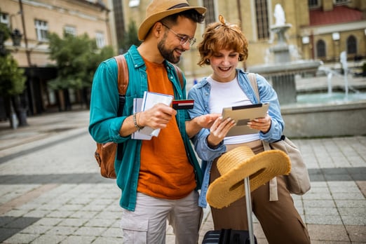 A couple using a credit card in a foreign country