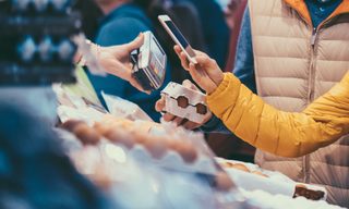 Shopper pays with digital wallet using their phone