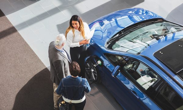 Couple car shopping at dealer
