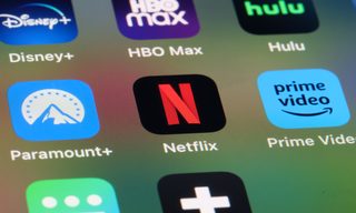 The High Stakes Behind the Netflix/Paramount Bidding War For Warner Bros.