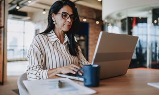 Portrait of a mature businesswoman working on a laptop