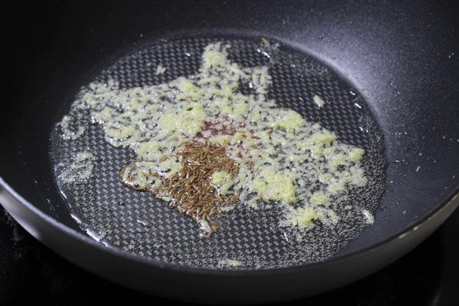 sauteing cumin ginger for baby corn fry