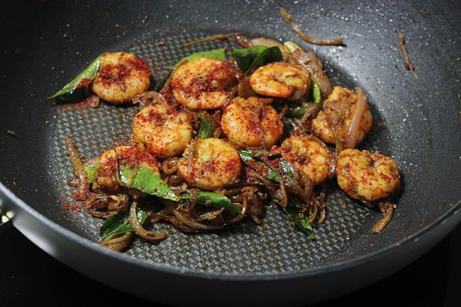 addition of chili powder to the stir fried prawns