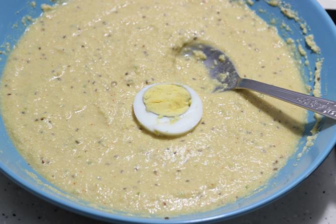 dipping egg slices in batter