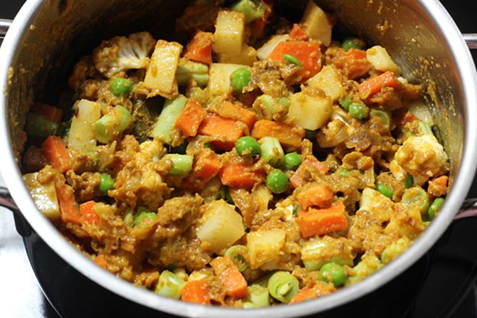 sauteing veggies in masala