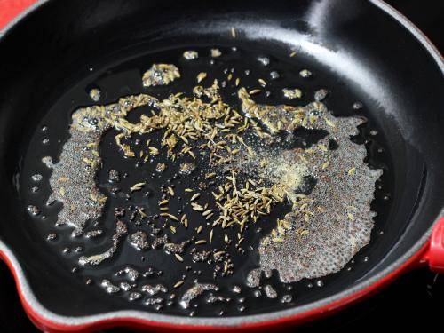 tempering spices in oil to make poha recipe