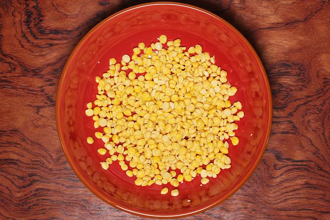 Wash and soak chana dal for ambode