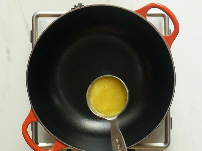 pouring ghee to pan to make lauki halwa