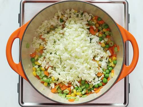 adding cabbage for vegetable soup