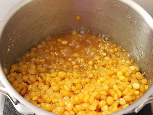 cooking chana dal and jaggery syrup for boorelu recipe