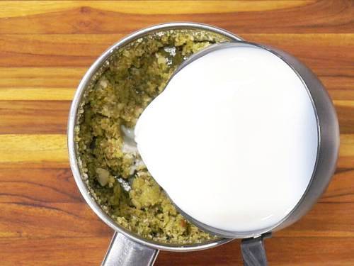 pouring milk to make thandai paste