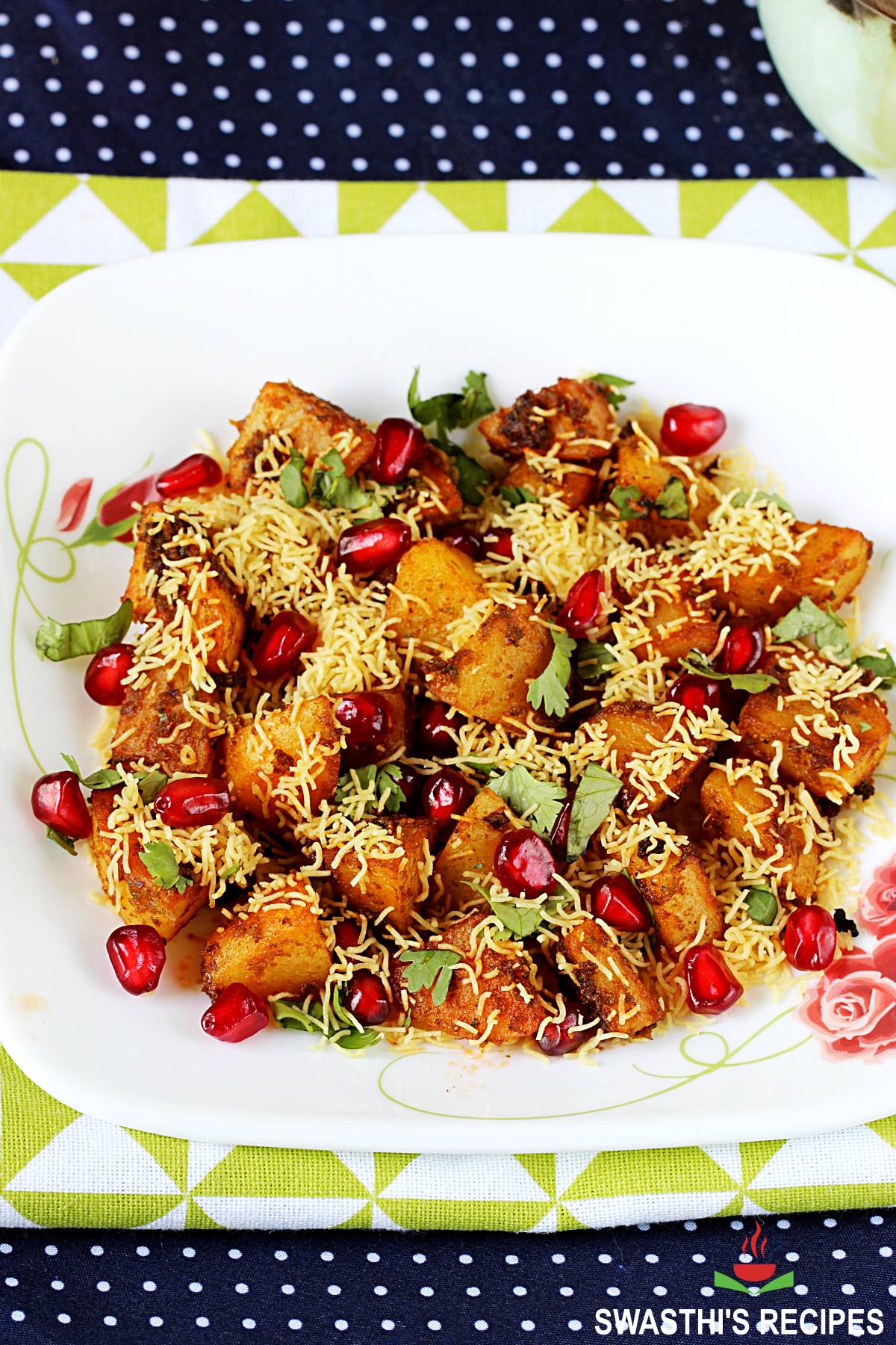 aloo chaat garnished with sev and pomegranate arils