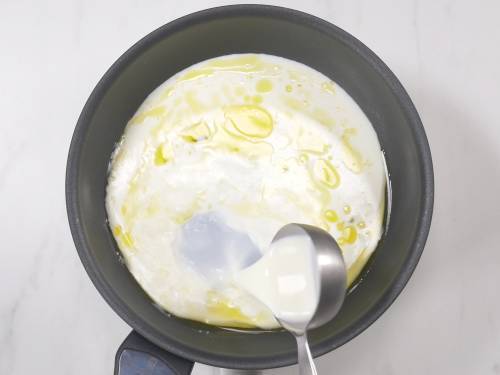 pour milk to make khoya