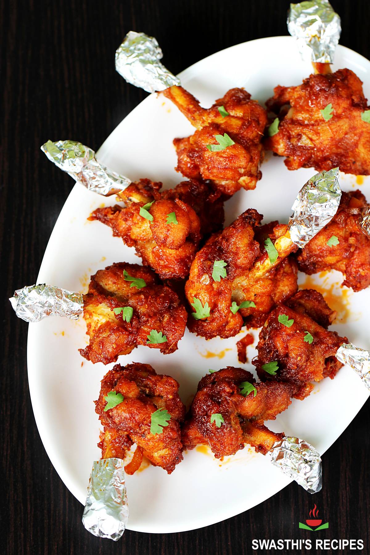 Chicken lollipop tossed in schezwan sauce