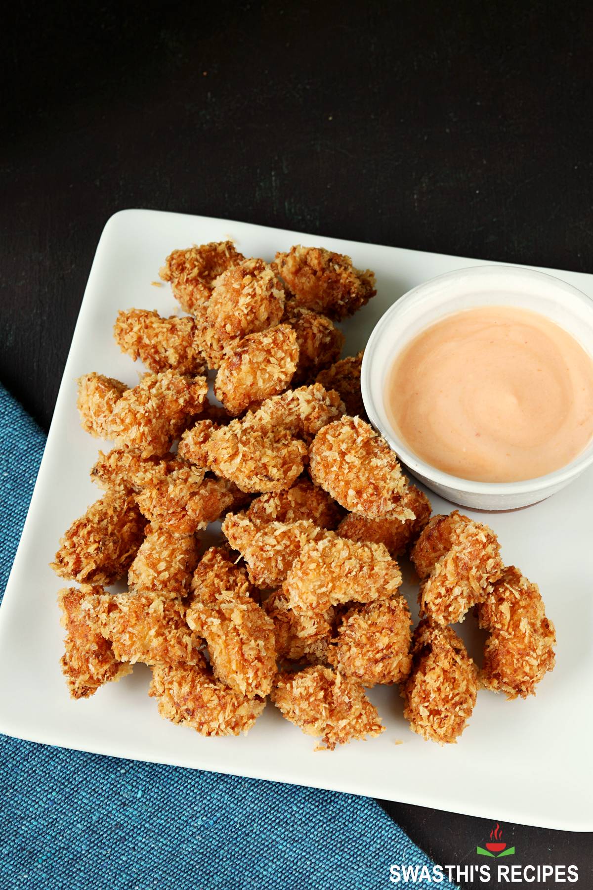 popcorn chicken served in a white plate