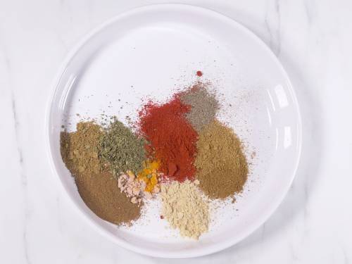 add the spices to a baking tray
