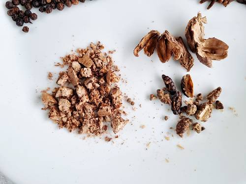 break open nutmeg and black cardamoms