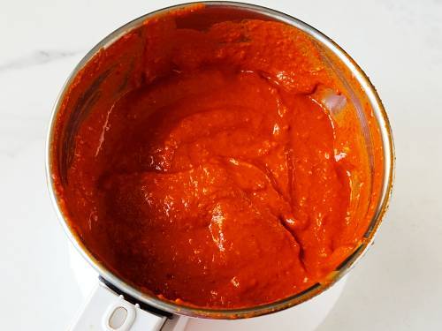 red garlic chutney in a jar to make dabeli