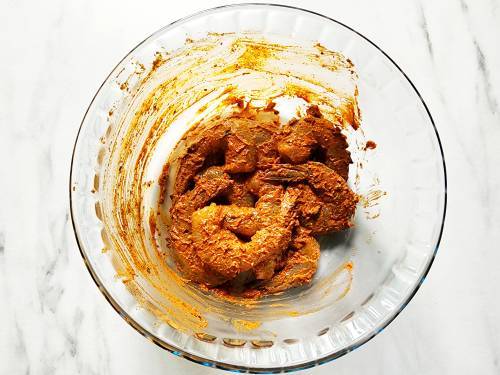 tandoori marinated shrimp in a bowl
