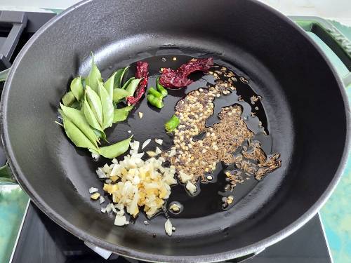 temper the spices and herbs in ghee